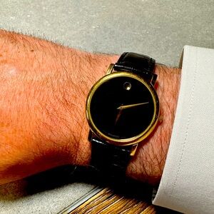 Men’s MOVADO watch. 33mm. Stainless Steel.  Leather band. Black and Gold.